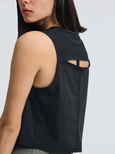 Back view of Millennia Round Neck Cropped Active Tank in black, showcasing its stylish design and keyhole detail.