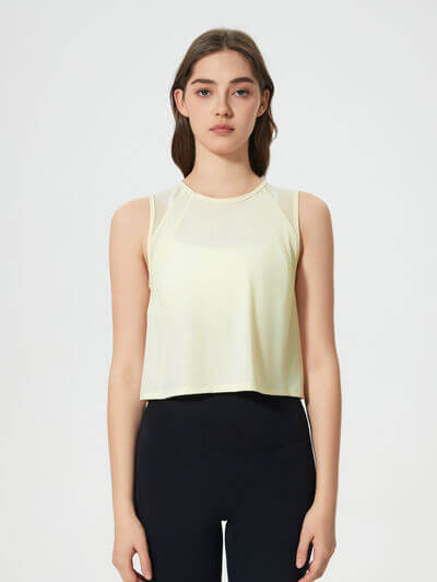 Millennia round neck cropped active tank in light yellow, designed for comfort and high stretch performance.
