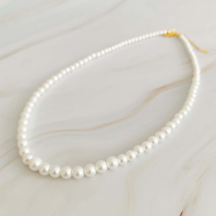 Queen Liz Graduated Pearl Necklace featuring cream-toned graduated pearls from 4mm to 7mm, 18" long with 2" extender.