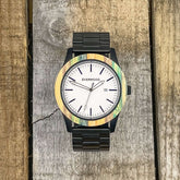 Inverness SS Multi-Colored Bamboo Wood and Stainless Steel Watch on rustic wooden background.