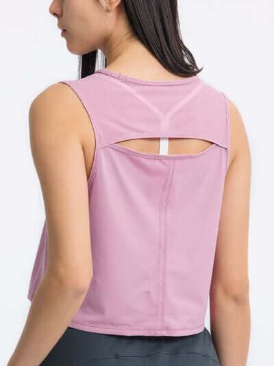 Back view of Millennia Round Neck Cropped Active Tank in pink, showcasing its stylish cut and stretch fabric.