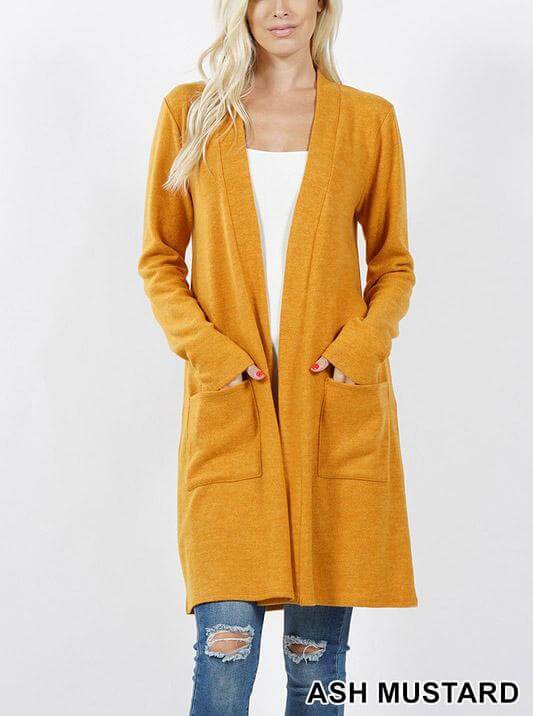 Brushed sweater pocket cardigan in ash mustard, featuring long sleeves and two side pockets, perfect for cold-weather layering.