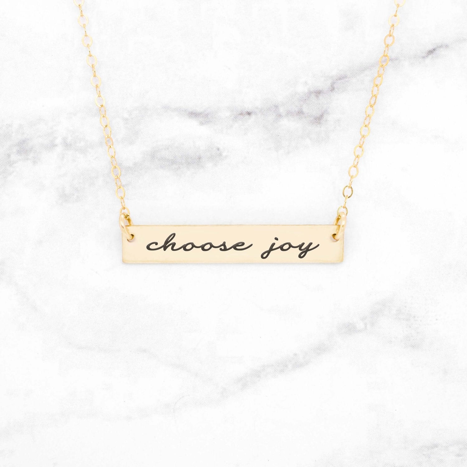 Rose gold bar necklace with the inscription &