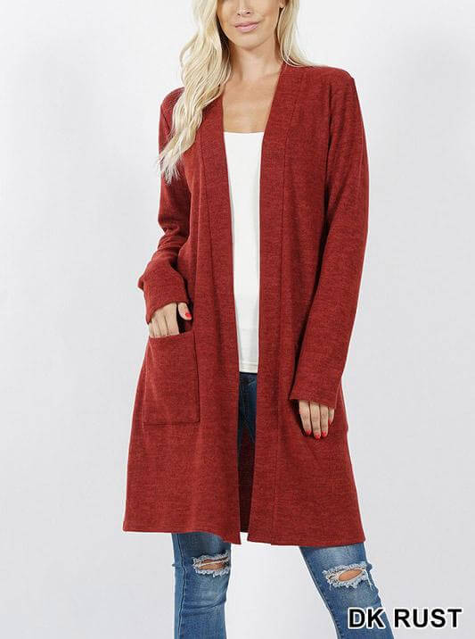 Brushed sweater pocket cardigan in dark rust color, featuring long sleeves and an open front design.