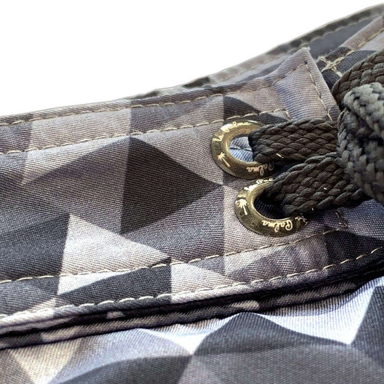 Close-up of Sustainable Surf Geometric Gray boardshorts showcasing the unique pattern and fixed waist design.