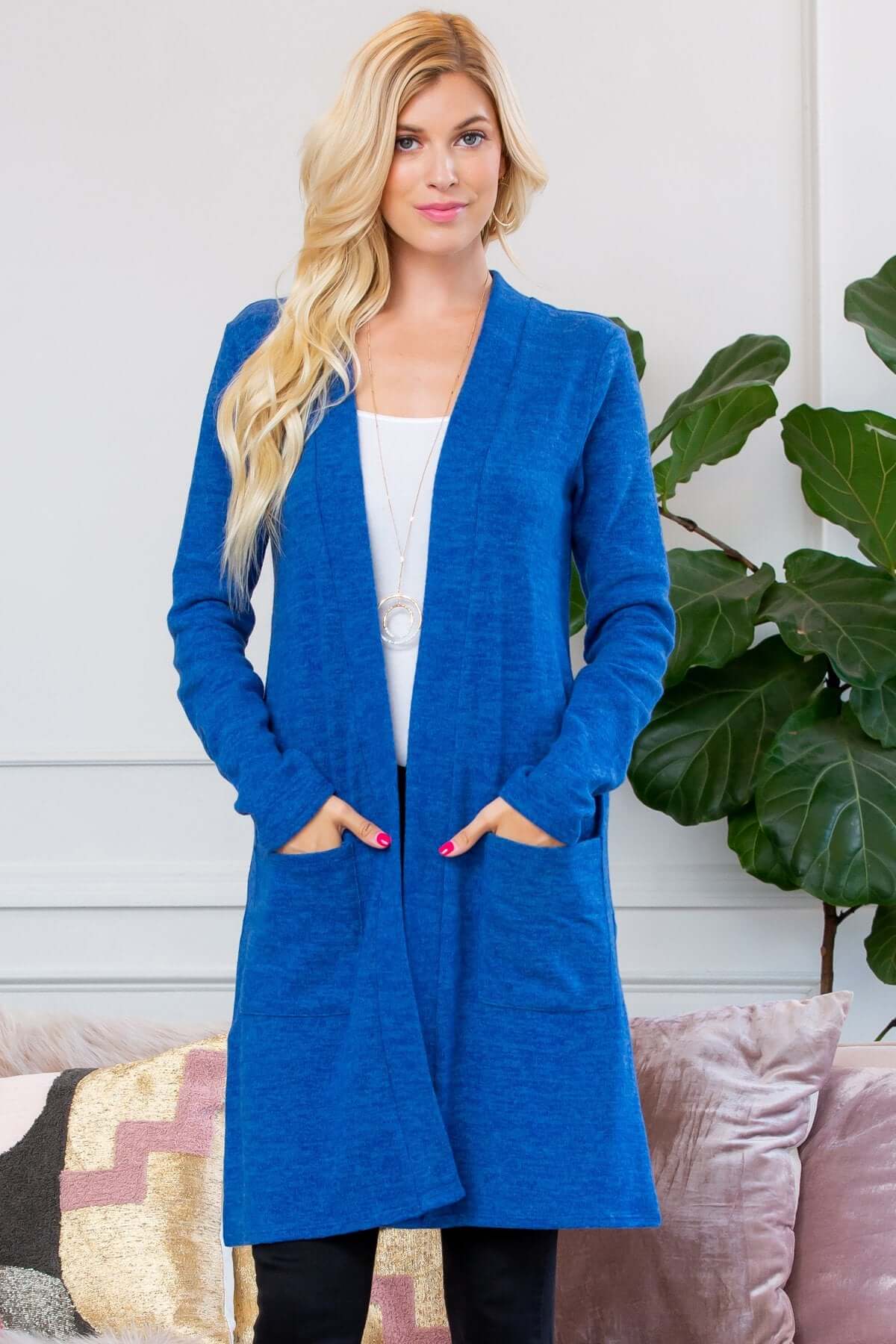 Brushed blue sweater pocket cardigan with open front and long sleeves, perfect for layering in cold weather.