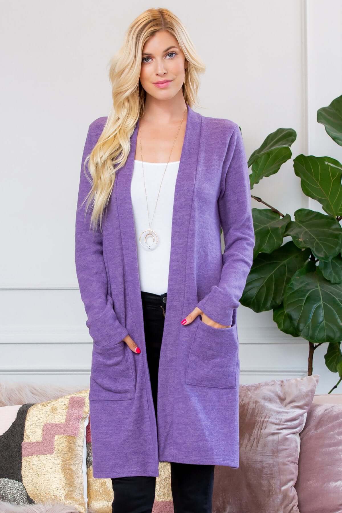 Soft brushed purple cardigan with long sleeves and two side pockets, perfect for cold-weather layering.