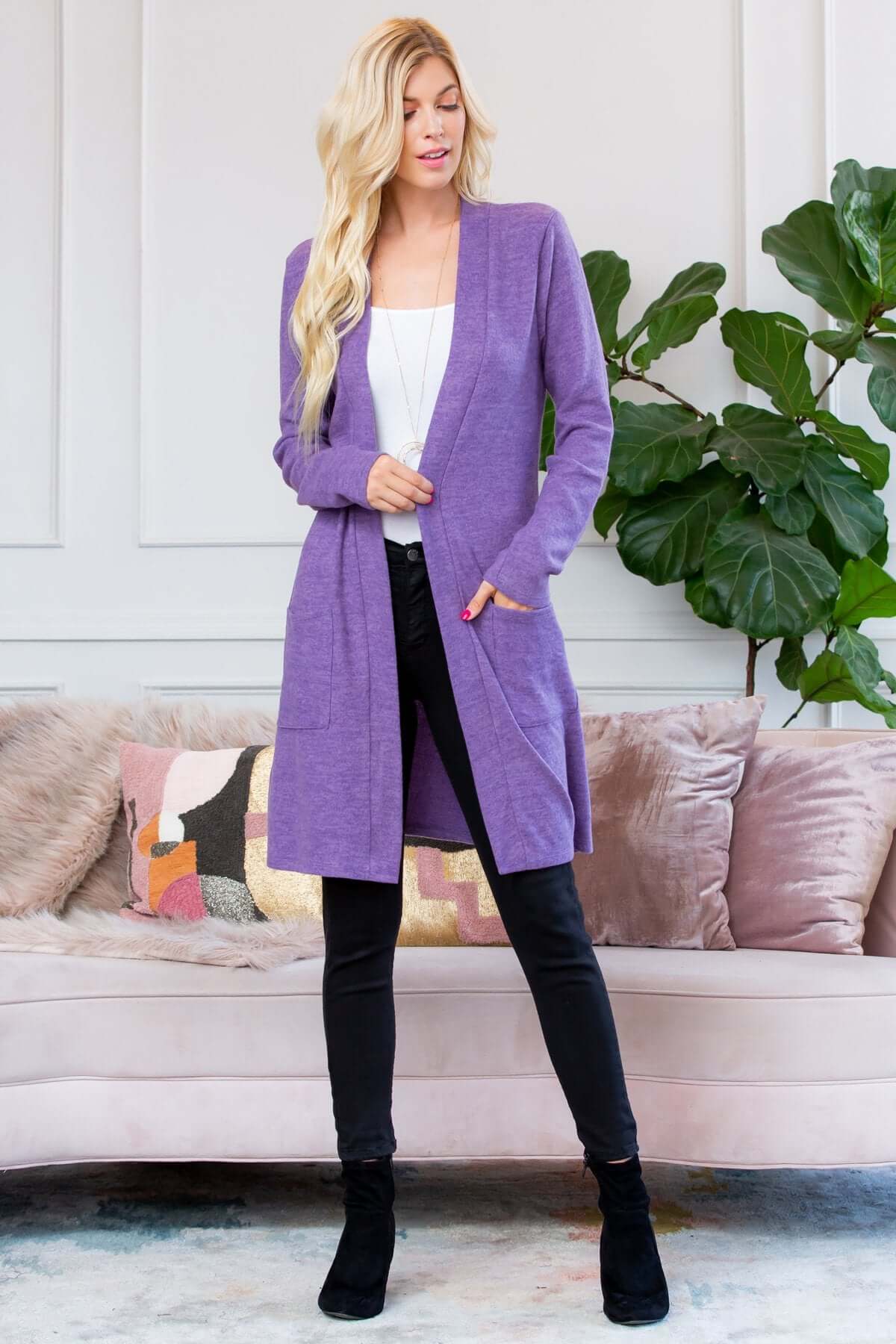 Brushed sweater pocket cardigan in purple, styled over a white top and black jeans, perfect for cold-weather layering.