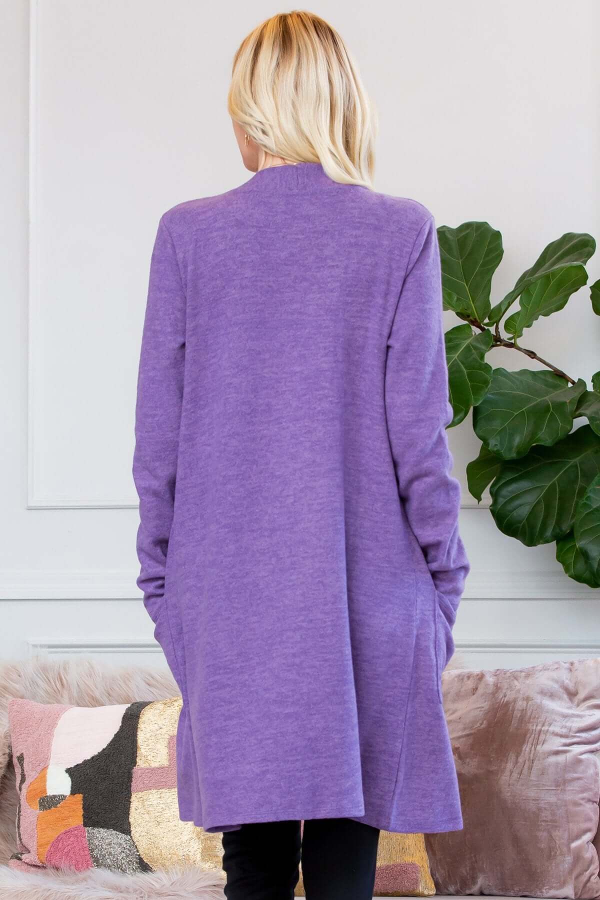 Back view of a soft brushed purple pocket cardigan, showcasing long sleeves and layered silhouette.