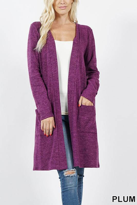 Soft brushed plum cardigan with long sleeves and side pockets, perfect for cold-weather layering.