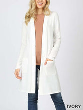 Ivory brushed sweater pocket cardigan with long sleeves, open front, and two side pockets, perfect for layering.