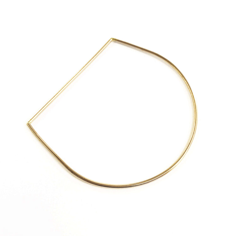 Nikki Bangle: a sleek, minimalist gold bangle, perfect for stacking or wearing solo for elegant style.