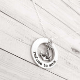 Hand-stamped refuse to sink washer necklace with anchor charm on an 18-inch chain, ideal gift for encouragement.
