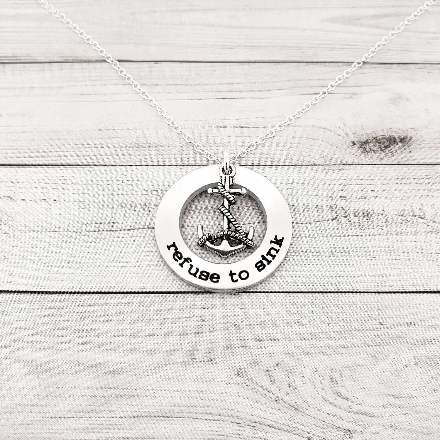 Refuse to Sink washer necklace with anchor charm on a silver ball chain, handcrafted custom jewelry gift.
