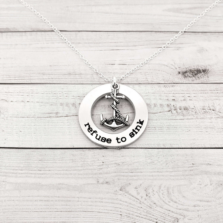 Refuse to Sink washer necklace with anchor charm on a silver ball chain, handcrafted custom jewelry gift.