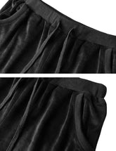 Close-up of black knit fabric waistband and drawstrings on women&