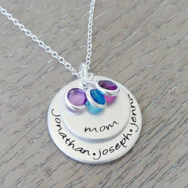 Personalized mom necklace with engraved names and colorful birthstone charms on a silver chain.