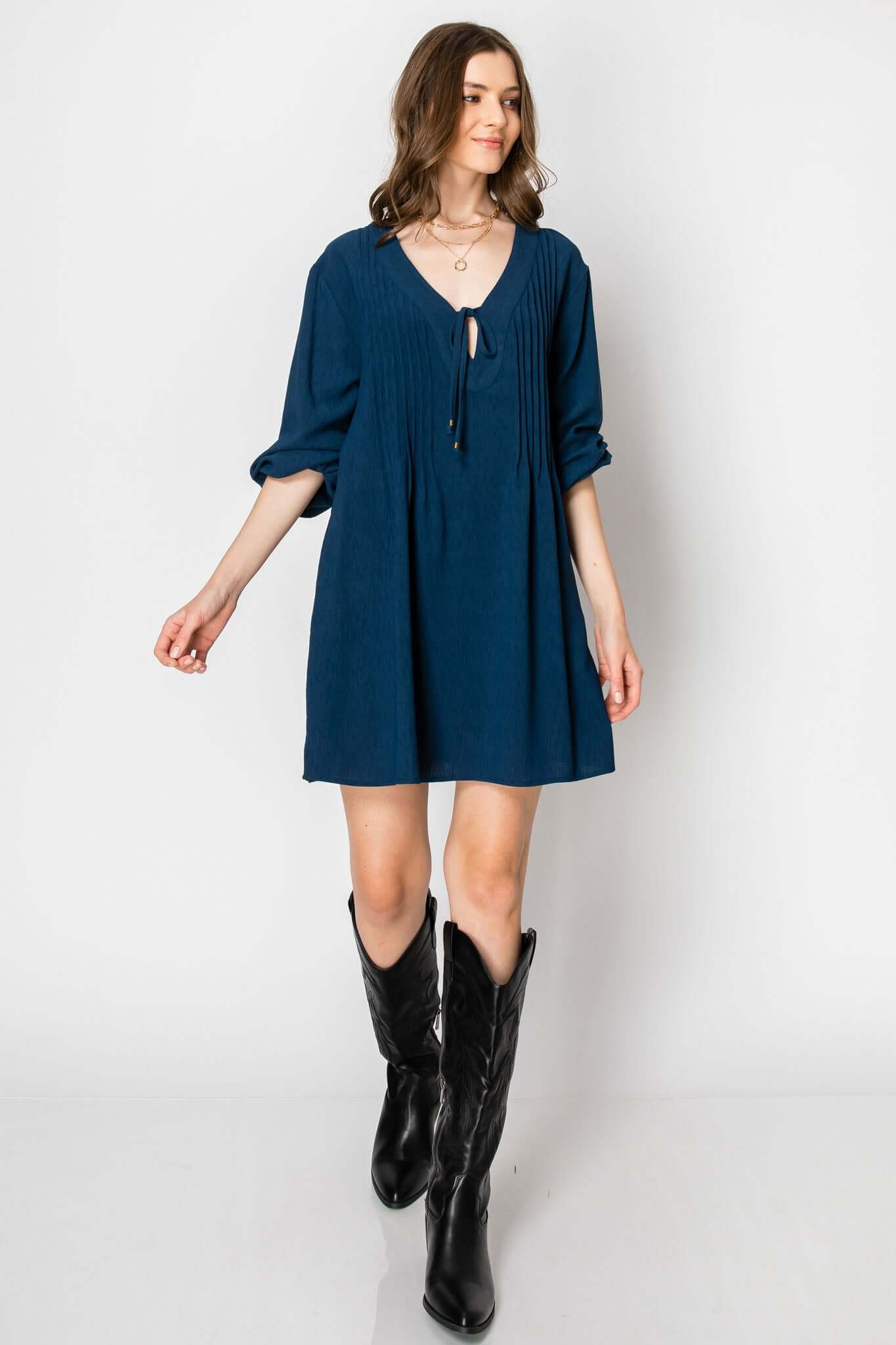 Long sleeve pintuck A-line dress with front tie, paired with black Western boots, perfect casual fall look.