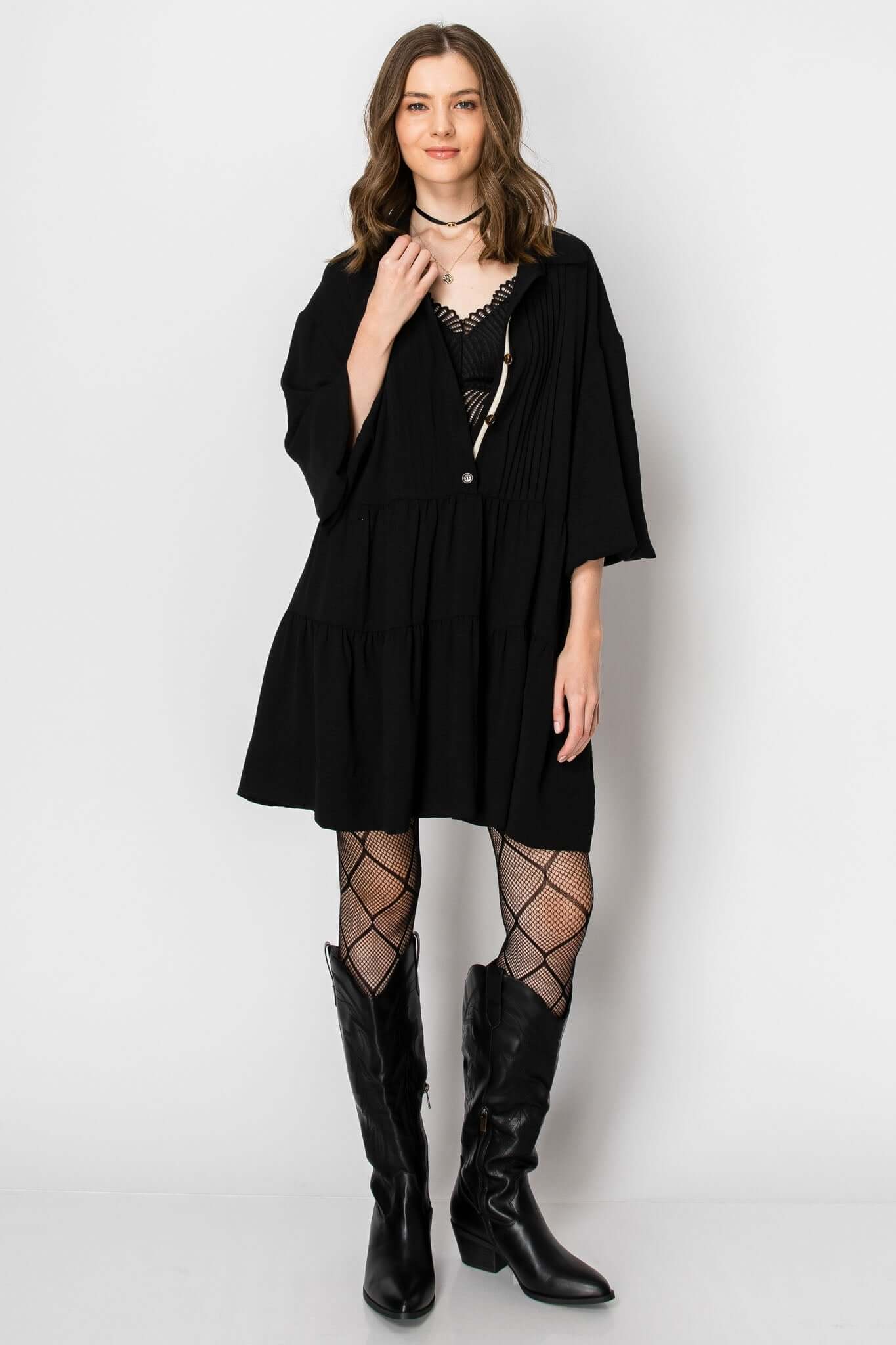 Long sleeve collared button down ruffle dress, styled with fishnet tights and western boots, perfect for fall looks.