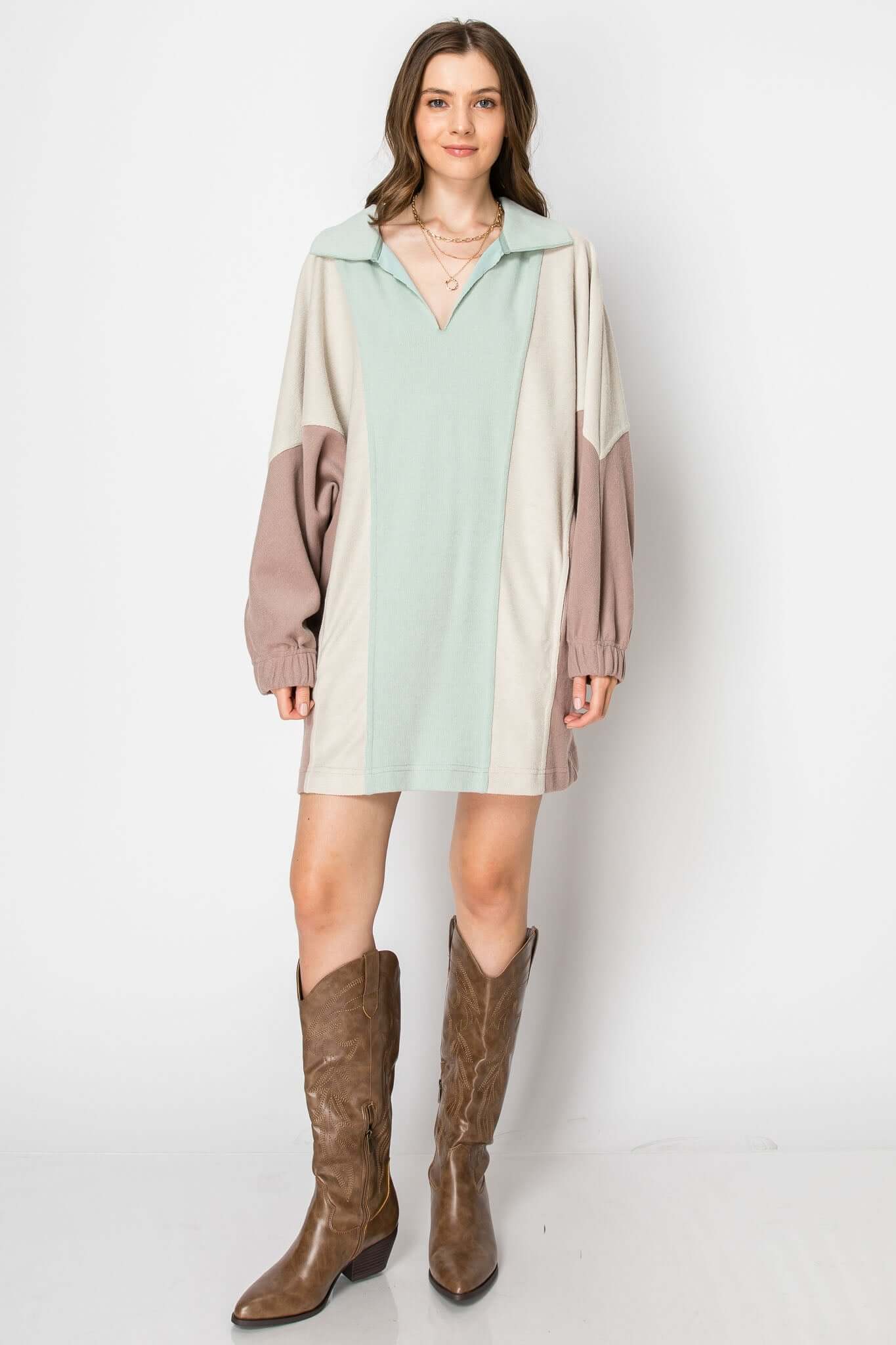 Color block long sleeve collared mini dress with pockets, styled with brown western boots.