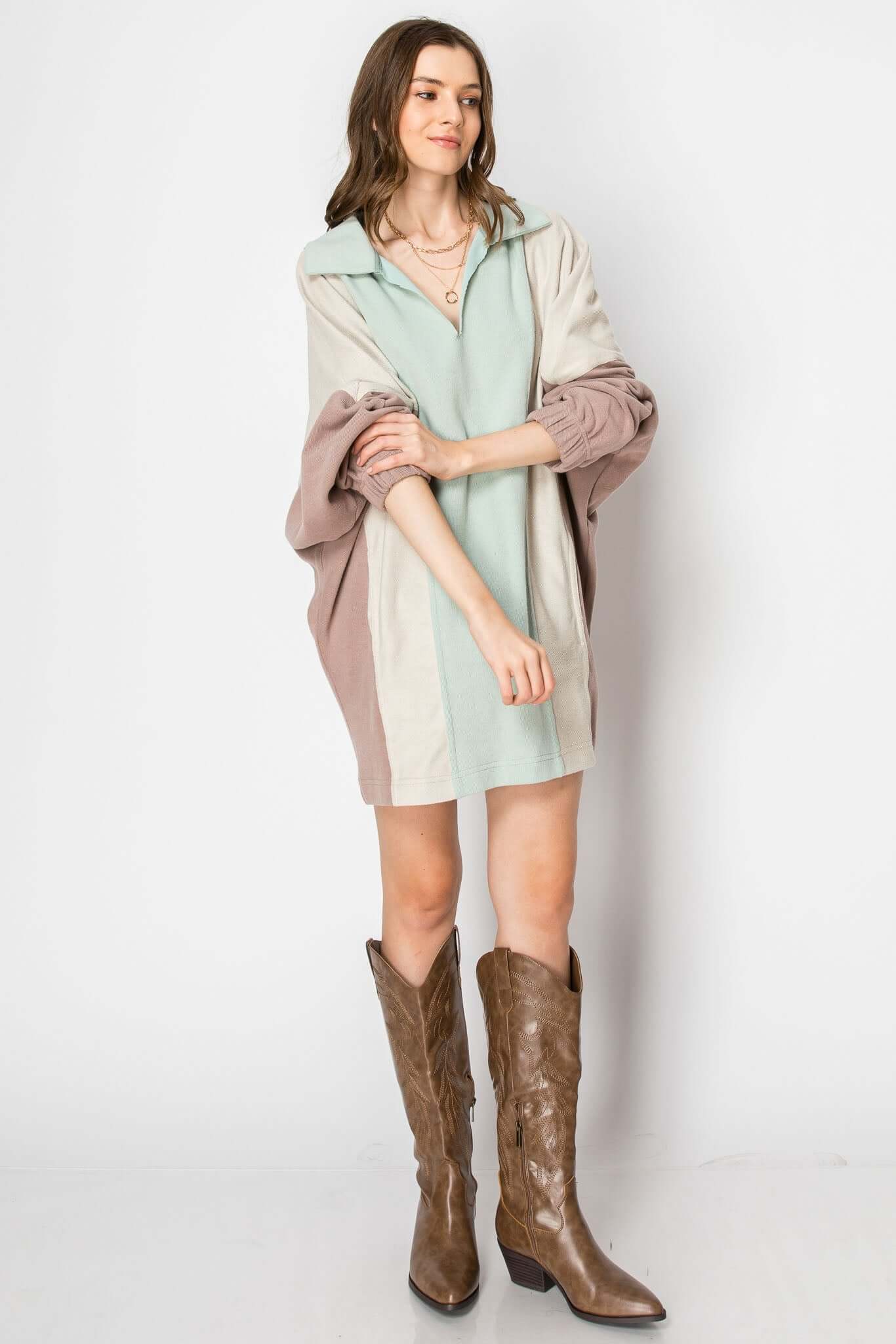 Color block long sleeve collared mini dress with pockets, styled with brown western boots for fall fashion.