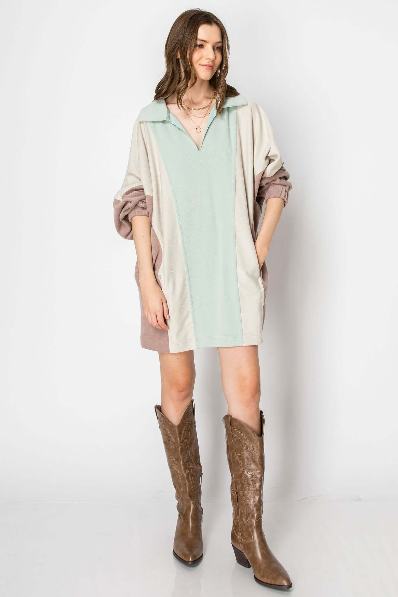 Color block long sleeve collared mini dress in soft fall fabric, styled with brown western boots.