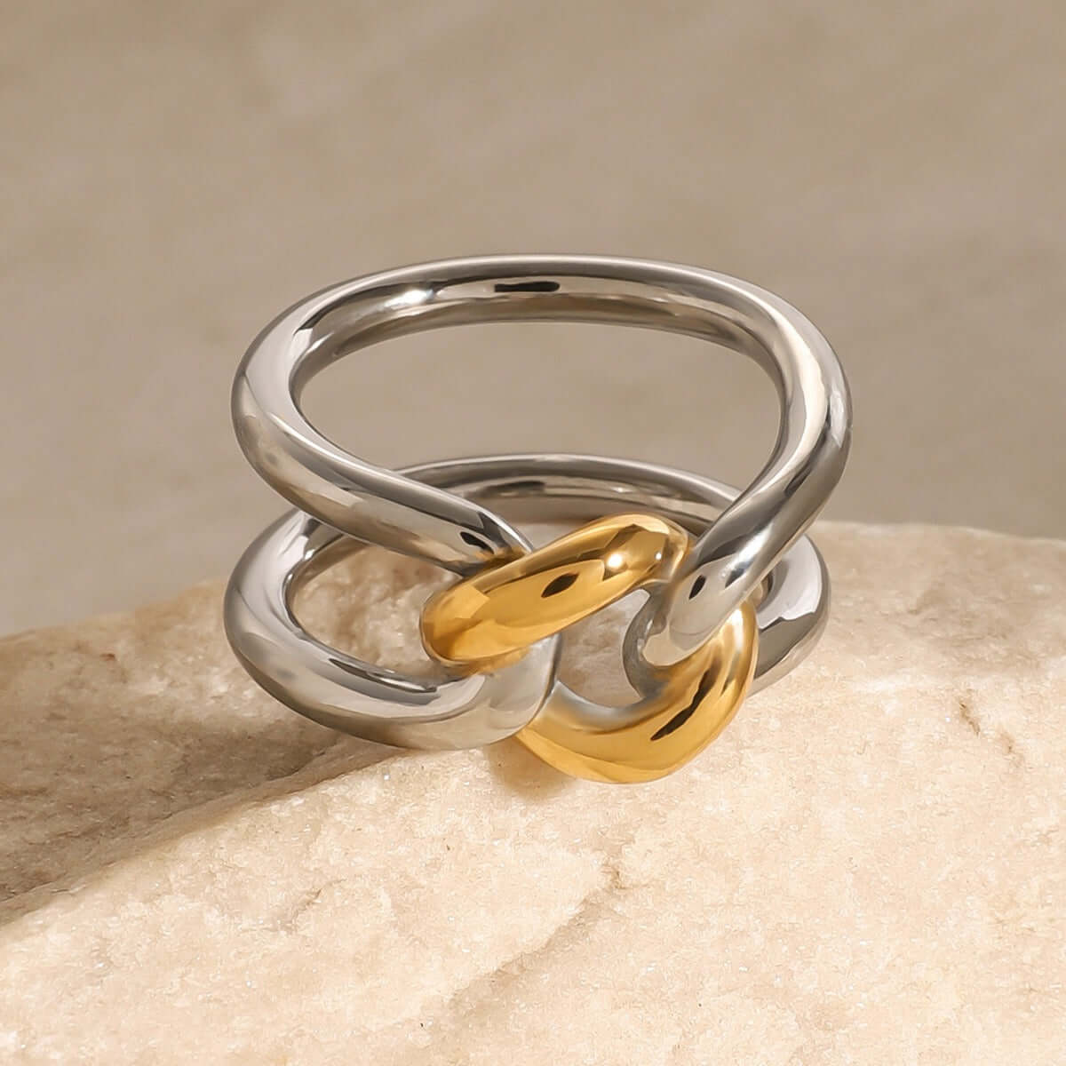 18K gold-plated hollow ring featuring a unique gold and silver contrast design in an elegant style.