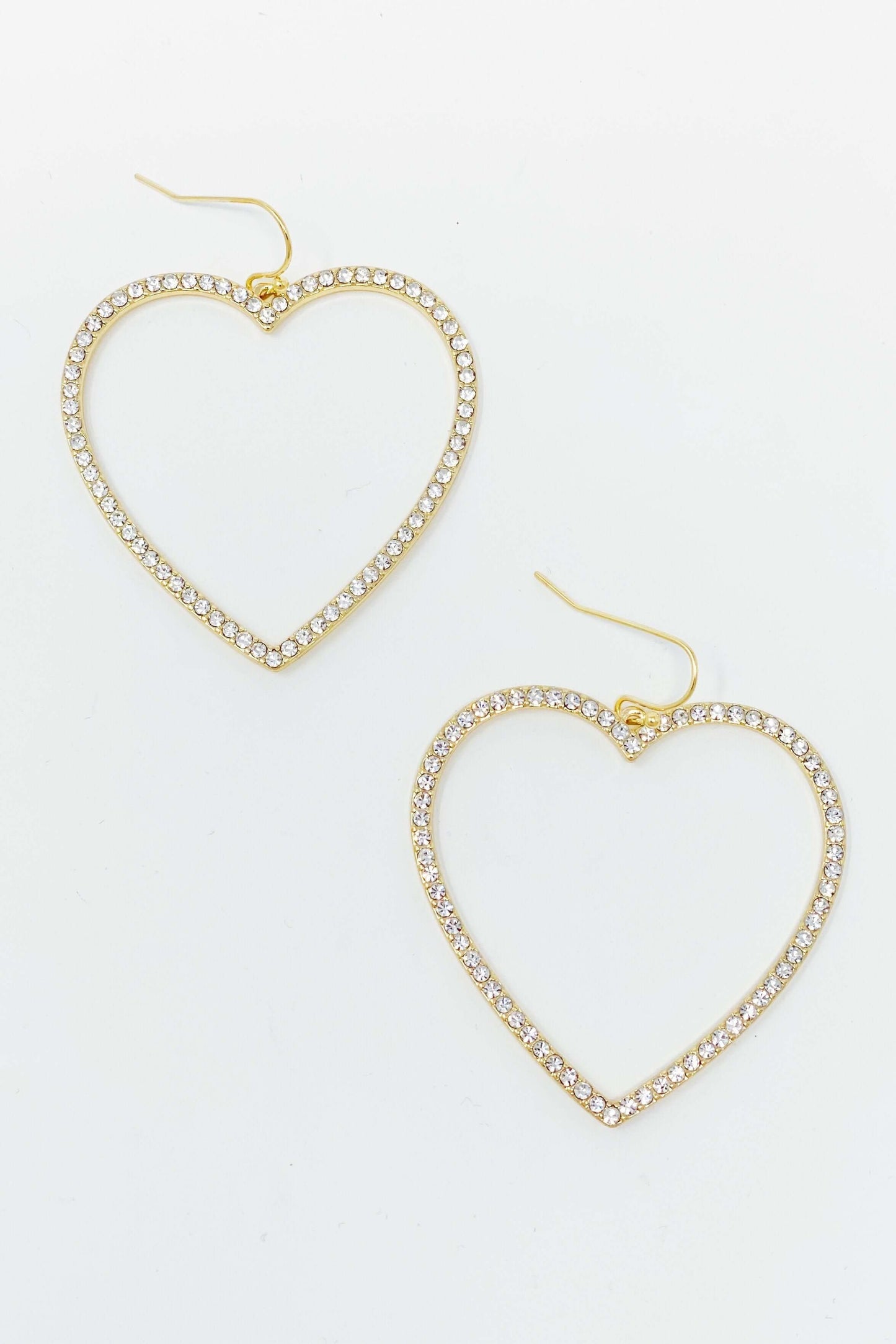 Elegant gold heart earrings with rhinestones, 2x2 inches, perfect for adding sophistication to any outfit.