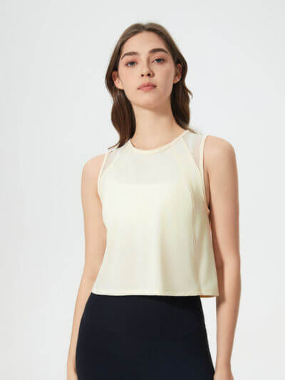 Millennia Round Neck Cropped Active Tank in light yellow, featuring a sleek design and stretchy fabric.