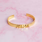 Gold plated open bangle bracelet with &