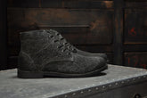 The Grover Vegan Charcoal boot in burnished canvas, showcasing rugged style and lightweight comfort.