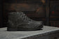 The Grover Vegan Charcoal boot in burnished canvas, showcasing rugged style and lightweight comfort.