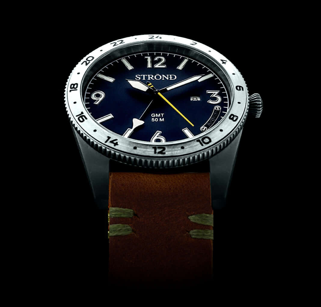 316 grade stainless steel watch with blue dial and rustic brown calfskin strap, featuring GMT function.