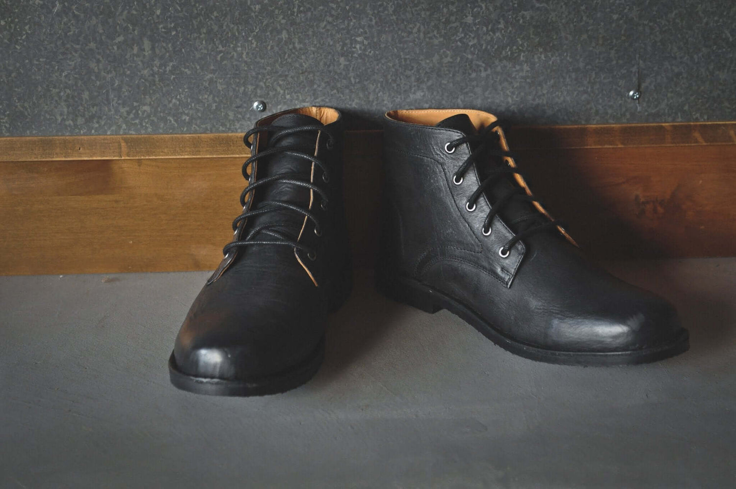 The Grover black leather desert boots with tall design and 5 eyelets for a stylish twist on a classic look.
