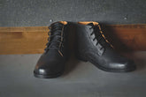 The Grover black leather desert boots with tall design and 5 eyelets for a stylish twist on a classic look.