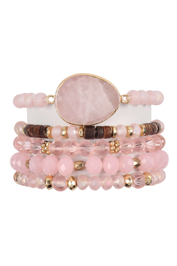 Natural stone and glass bead mixed charm bracelets in soft pink tones, featuring gold accents and stretchable design.