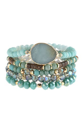 Natural stone charm mixed beads bracelets stacked featuring glass and base metal accents in vibrant teal colors.