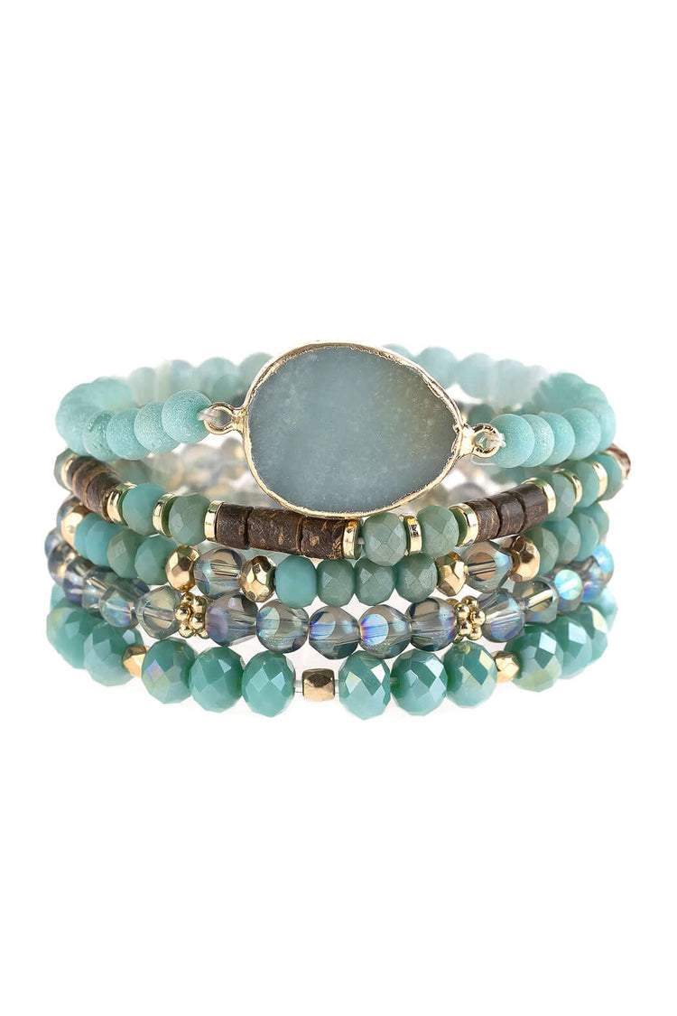 Natural stone charm mixed beads bracelets stacked featuring glass and base metal accents in vibrant teal colors.