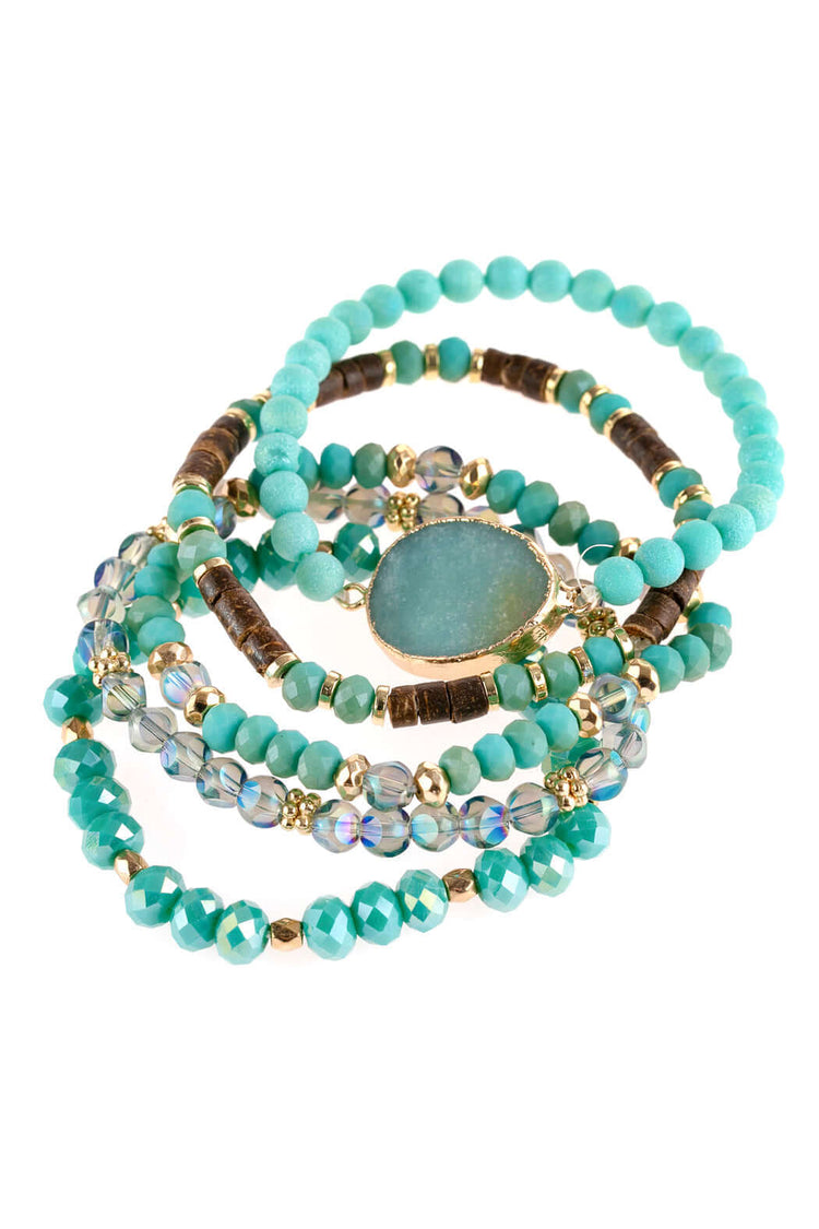 Natural stone charm mixed beads bracelets in turquoise, featuring ornate etching and sparkling accents.