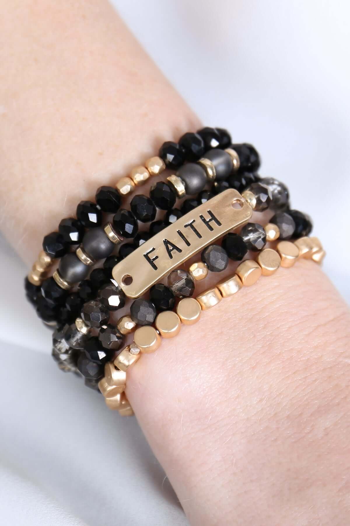 Chic 'Faith' charm mixed beads bracelet featuring black and gold beads, ideal for stacking or solo wear.