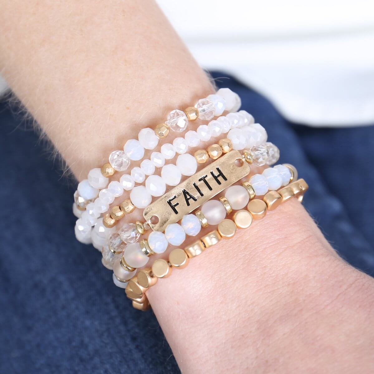 Stylish "Faith" charm mixed beads bracelet displayed on a wrist with gold and glass beads, perfect for layering.