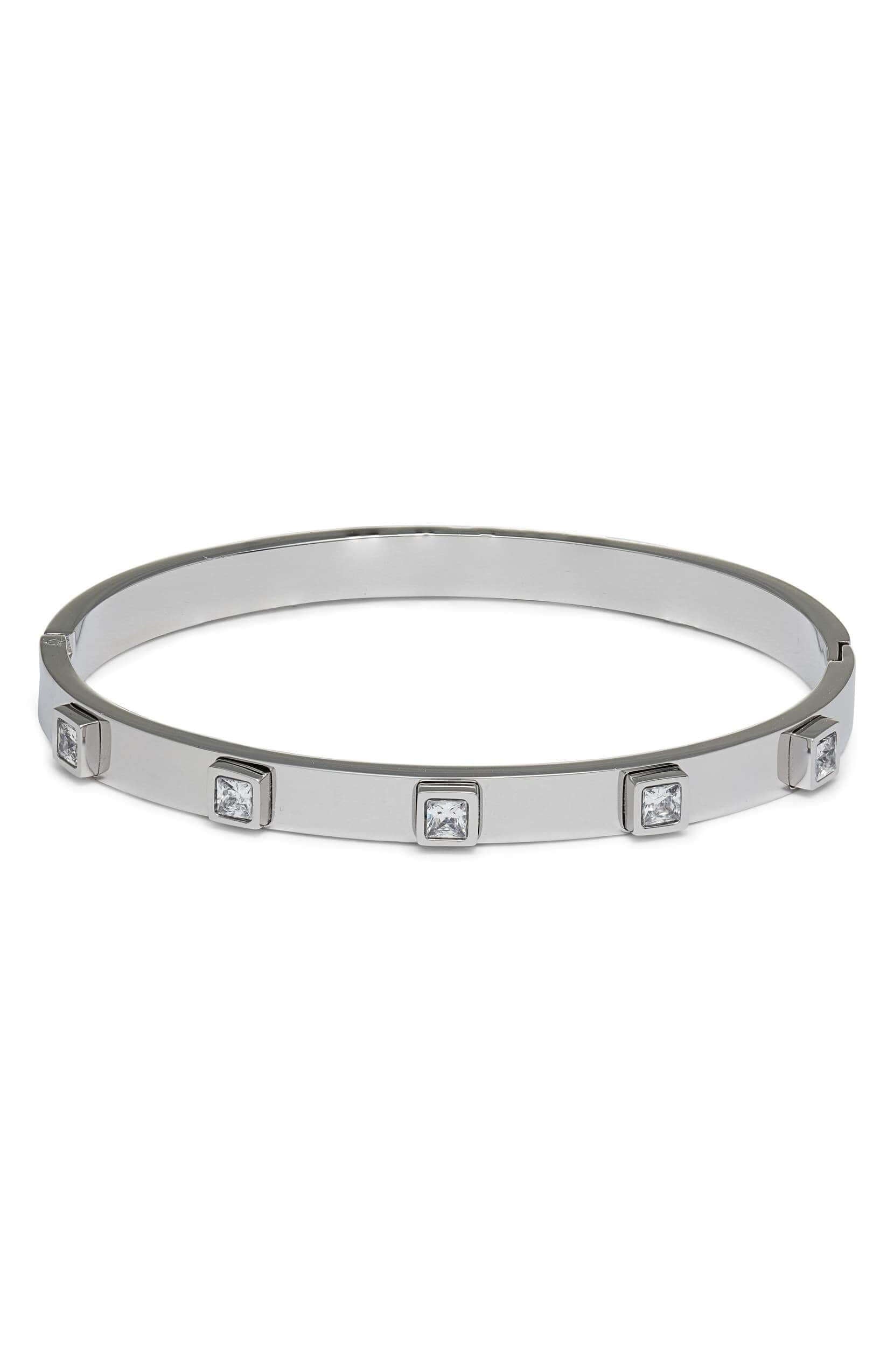 Glamorous silver crystal bangle with CZ crystal settings, perfect elegant accessory for any outfit.