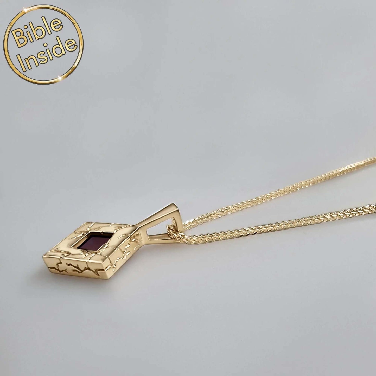 Gold rhombus necklace with engraved lightning design and ruby, featuring the Bible inside, stylish nano bible jewelry.