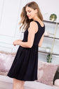 Black racerback tank dress with flared silhouette and on-seam pockets, perfect for summer styling.