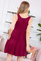 Back view of a burgundy racerback tank dress with on-seam pockets, perfect for summer styling.
