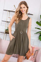 Stylish woman in olive racerback tank dress with pockets, perfect for summer outings.