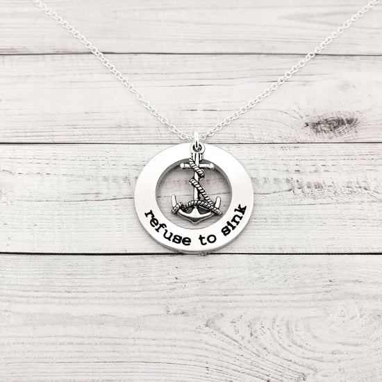 Refuse to Sink washer necklace with anchor charm on a silver ball chain, handcrafted custom jewelry gift.