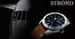 316 grade stainless steel watch with blue dial, rustic brown calfskin strap, and airplane background.