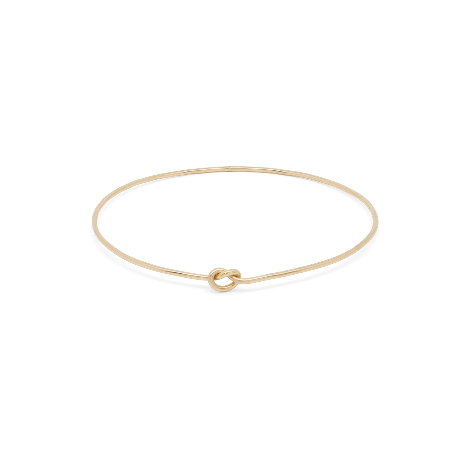 Elegant Shelby Love Knot Bangle in gold, featuring a unique knot design for a stylish accessory.