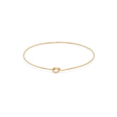 Elegant Shelby Love Knot Bangle in gold, featuring a unique knot design for a stylish accessory.